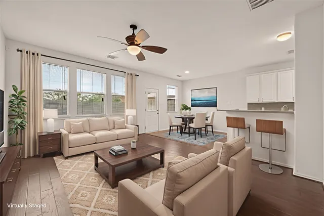 a living room with furniture and a large window