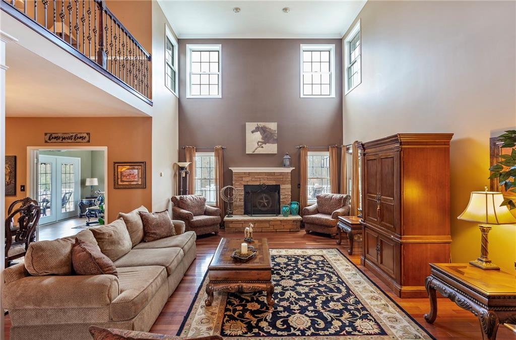 75 Galati Road McDonald, PA 15057 - Photo 11 of 25 Cozy stone fireplace (log-burning) & plenty of natural light.