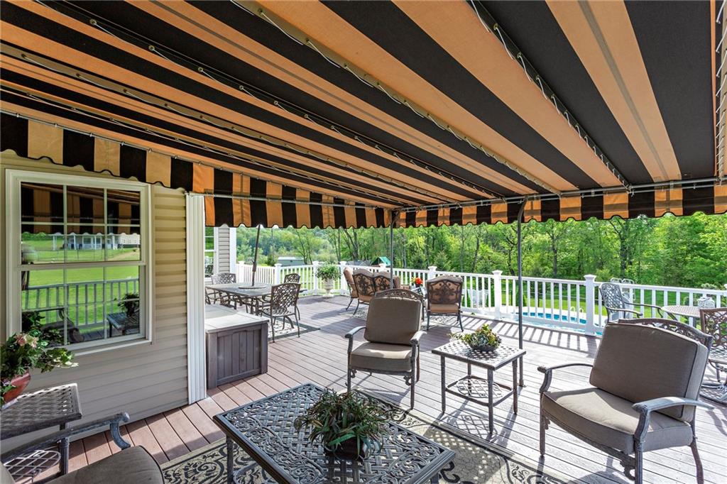 75 Galati Road McDonald, PA 15057 - Photo 22 of 25 850 Sq. Ft maintenance-free TREX deck with 2 awning covered areas overlooking the pool & beautiful grounds!