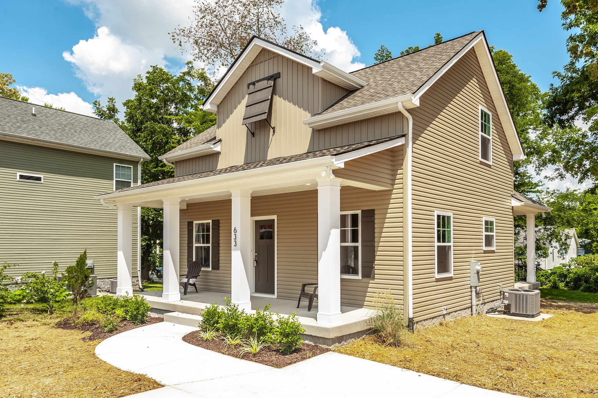 a view of a house with a yard