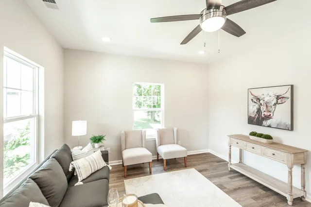a living room with furniture and a window