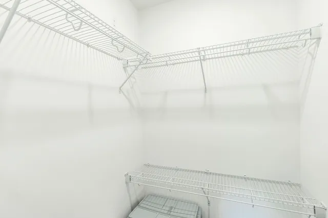 a bathroom with a bathtub a double vanity sink and a mirror