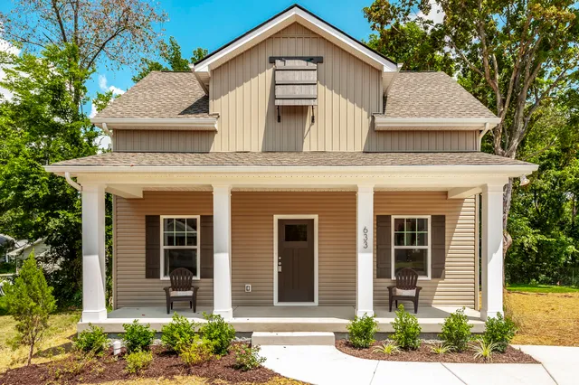 a front view of a house with garden