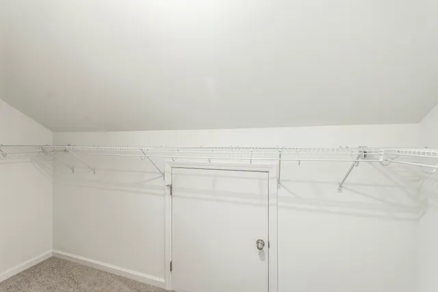 a bathroom with a double vanity sink a mirror and a shower