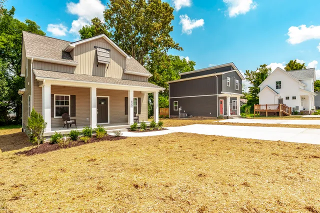 a house with swimming pool in front of it
