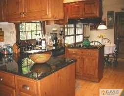 19 MacAfee Road Somerset, NJ 08873 - Photo 4 of 8 a view of a living room and kitchen