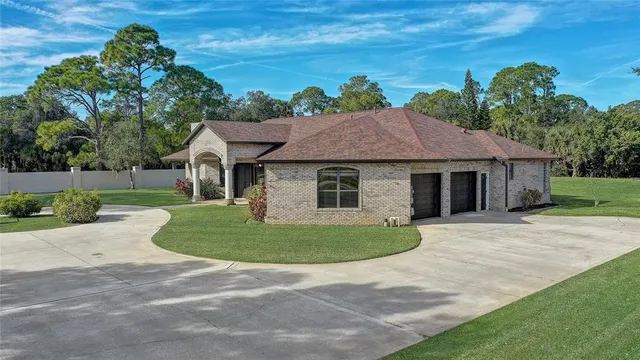 a living room with furniture and a view of kitchen