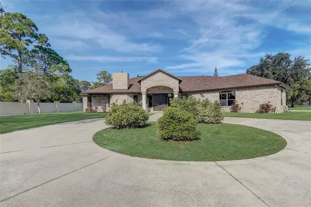 a kitchen with a sink stove top oven and refrigerator