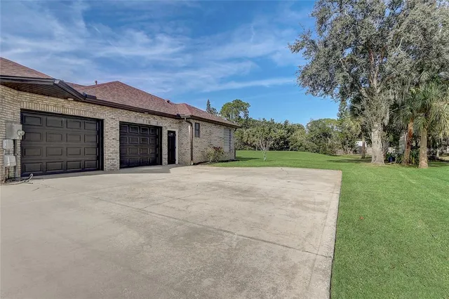 a bedroom with a bed and glass walk in closet