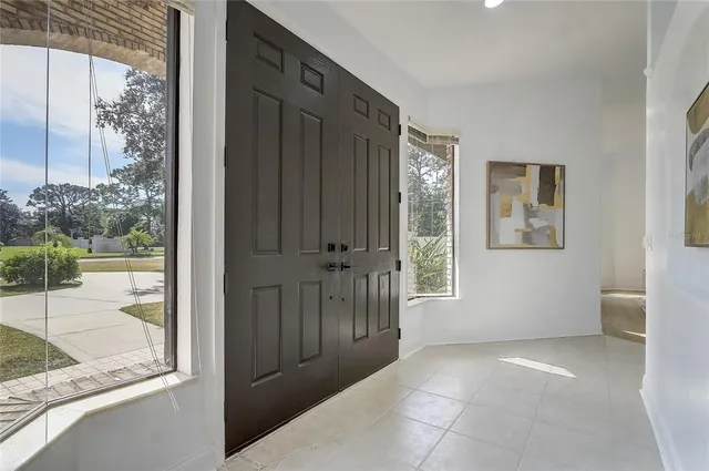 a view of empty room with wooden walls