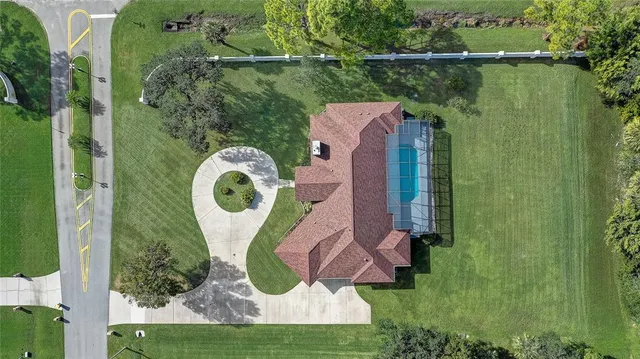 front view of a house with a yard and garage