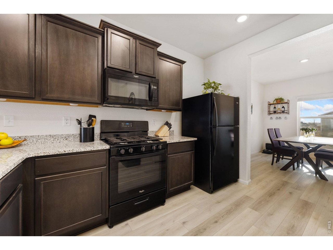 1078 Long Meadows Street Severance, CO 80550 - Photo 12 of 41 Kitchen with easy access to dining room