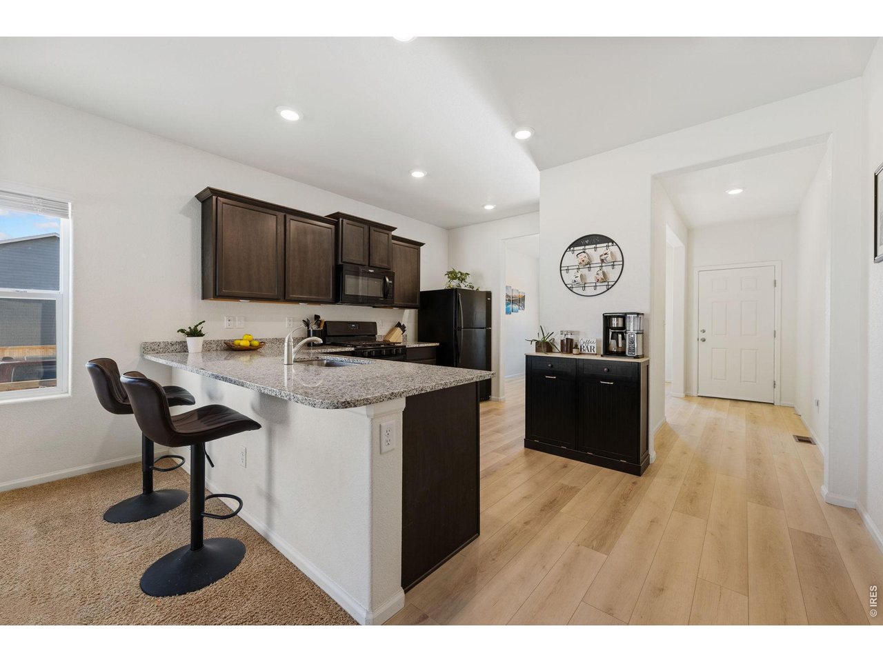 1078 Long Meadows Street Severance, CO 80550 - Photo 15 of 41 Kitchen with breakfast bar