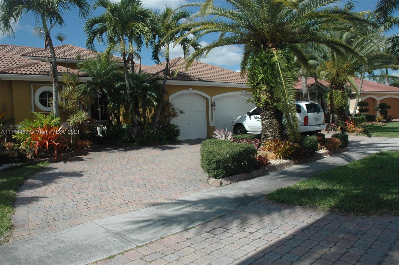 Miramar Miramar, FL 33029 - Photo 2 of 17 a couple of palm trees in front of house