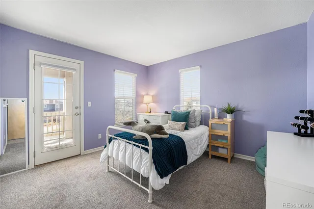 a bed room with a bed and a window