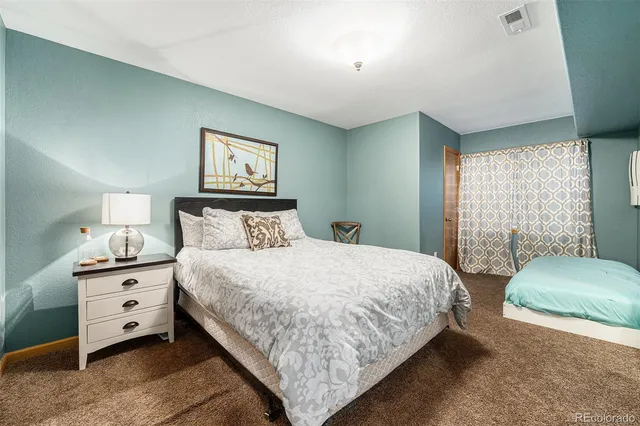 a bedroom with bed and window