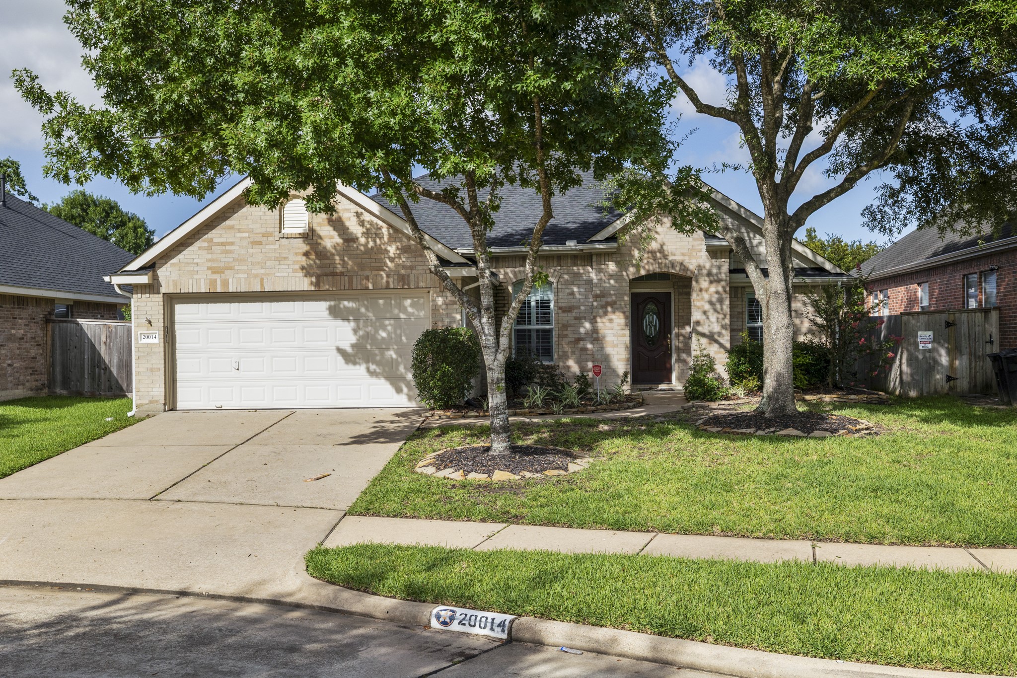20014 Queens Oak Court Spring, TX 77379 - Photo 2 of 49 a front view of house with yard and green space