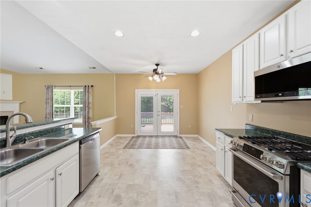 14719 Clover Ridge Lane Chesterfield, VA 23832 - Photo 12 of 36 Kitchen featuring white cabinetry, stainless steel