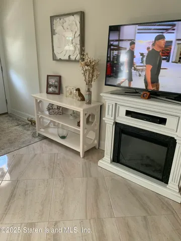 a bathroom with a shower a sink and a mirror