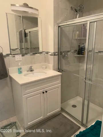 a bathroom with a sink a mirror and vanity