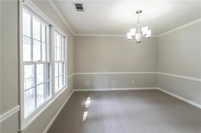 a view of empty room with a window