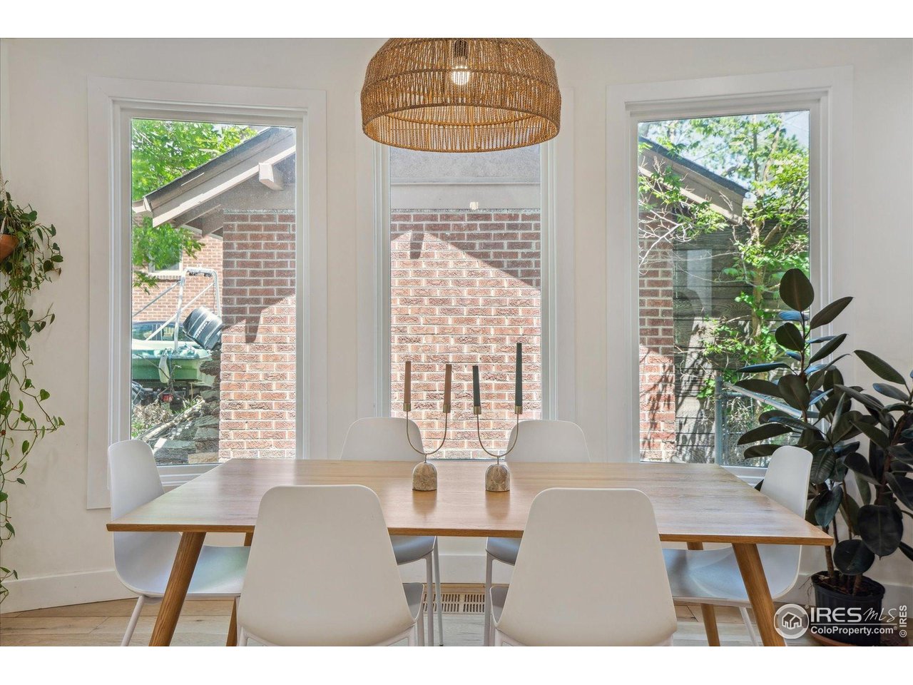 2844 Quitman Street Denver, CO 80212 - Photo 12 of 41 a view of a dining room with furniture window and wooden floor