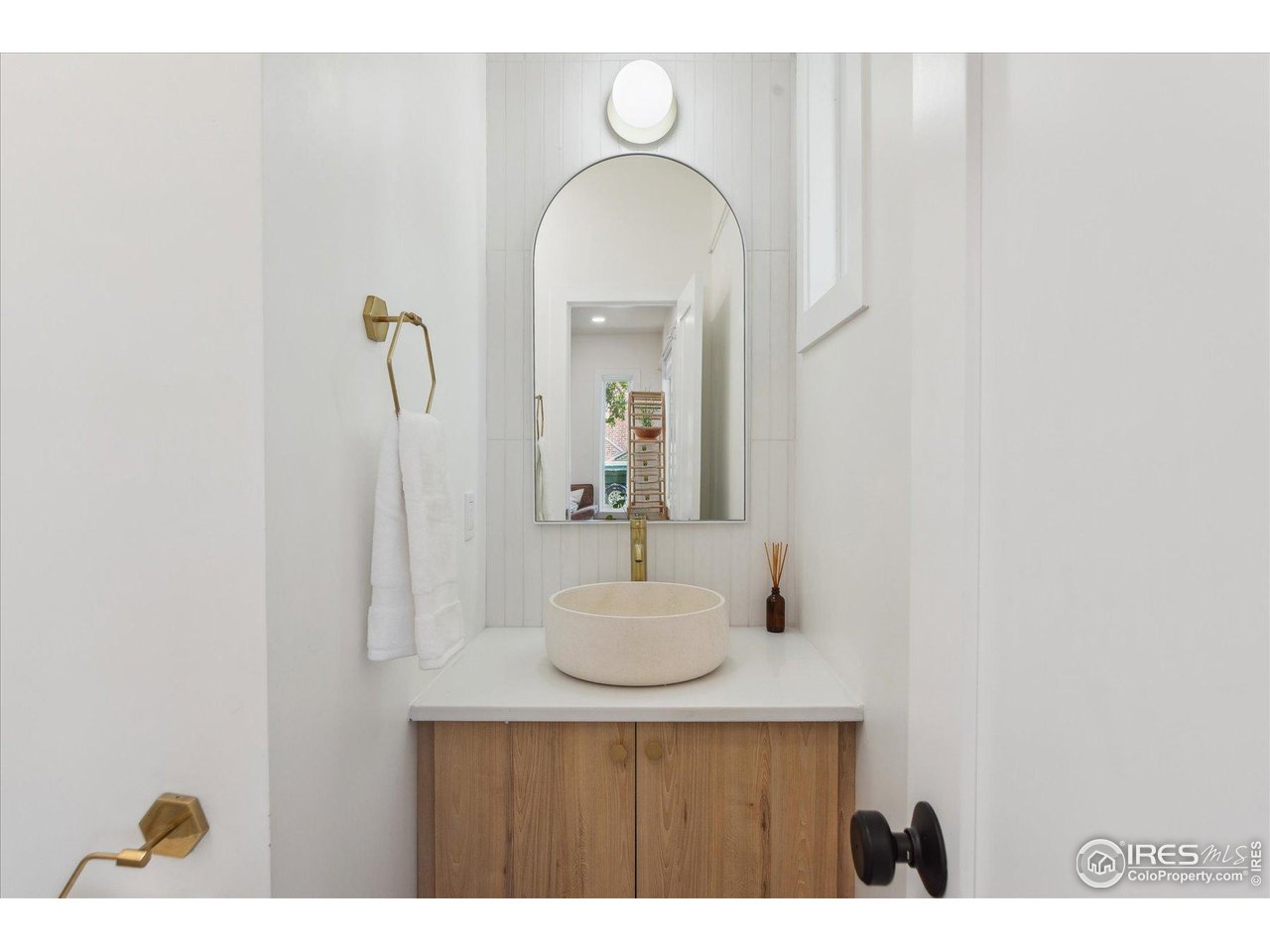 2844 Quitman Street Denver, CO 80212 - Photo 15 of 41 a bathroom with a sink and a mirror