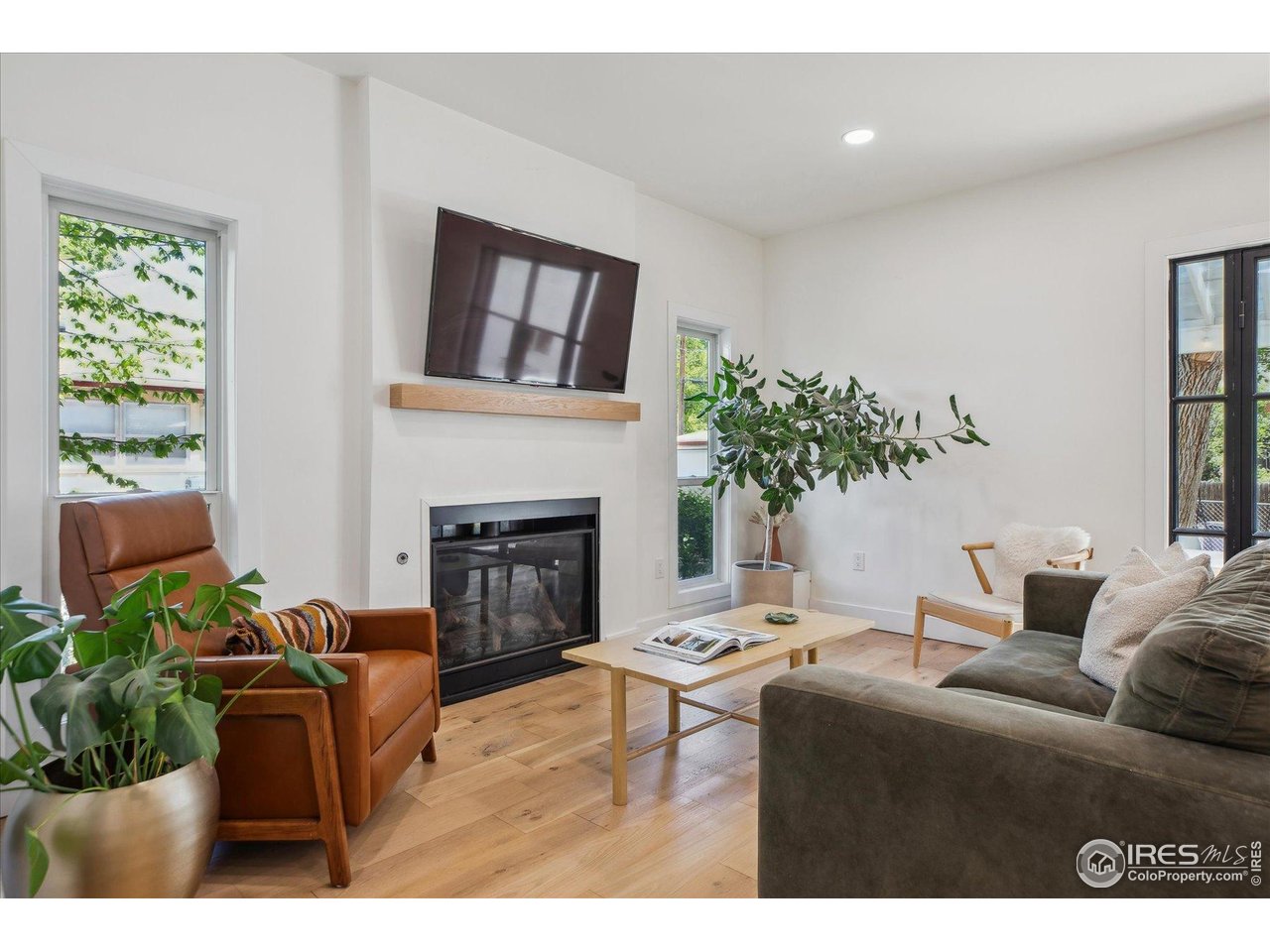 2844 Quitman Street Denver, CO 80212 - Photo 16 of 41 a living room with furniture potted plant and a fireplace