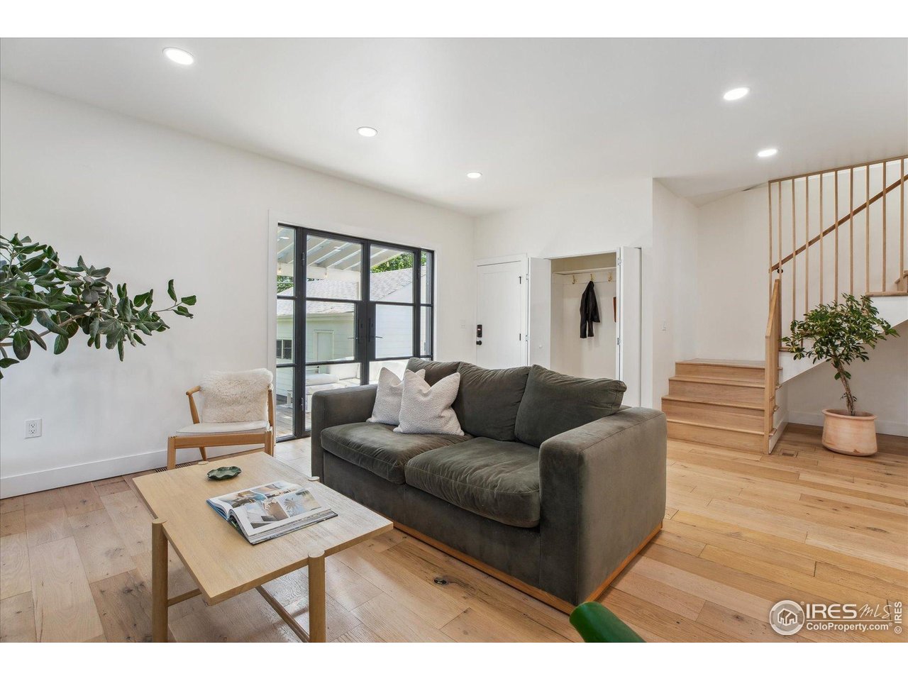 2844 Quitman Street Denver, CO 80212 - Photo 18 of 41 a living room with furniture a potted plant and a wooden floor