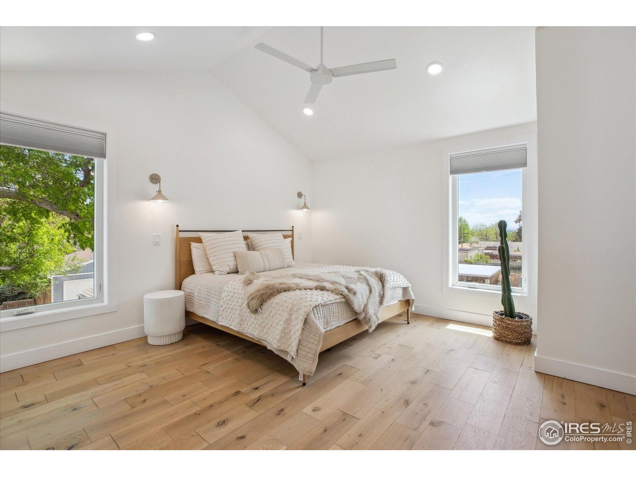 2844 Quitman Street Denver, CO 80212 - Photo 20 of 41 a bedroom with a bed and a wooden floor