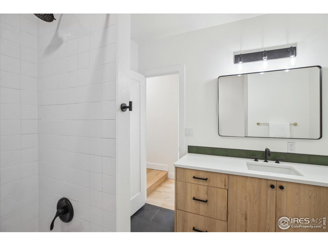 2844 Quitman Street Denver, CO 80212 - Photo 26 of 41 a bathroom with a sink and a mirror
