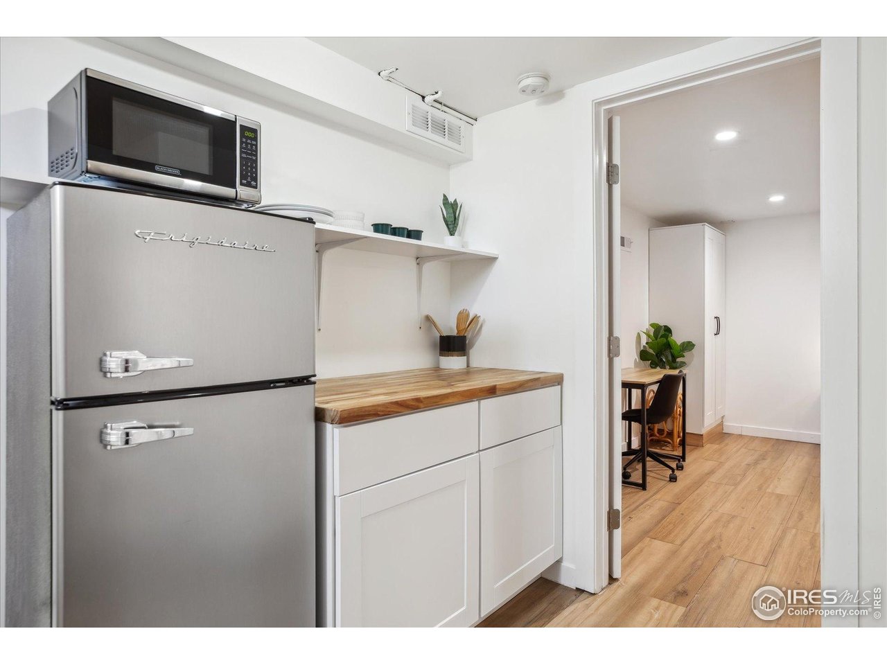 2844 Quitman Street Denver, CO 80212 - Photo 30 of 41 a kitchen with a refrigerator and a sink