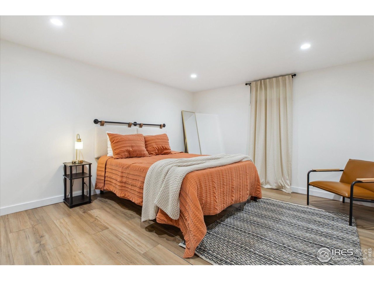 2844 Quitman Street Denver, CO 80212 - Photo 31 of 41 a bedroom with a bed and wooden floor