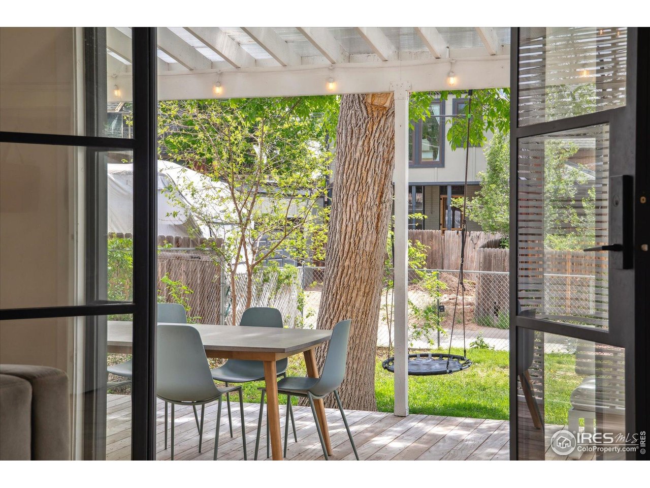 2844 Quitman Street Denver, CO 80212 - Photo 33 of 41 a view of a patio with table and chairs and potted plants