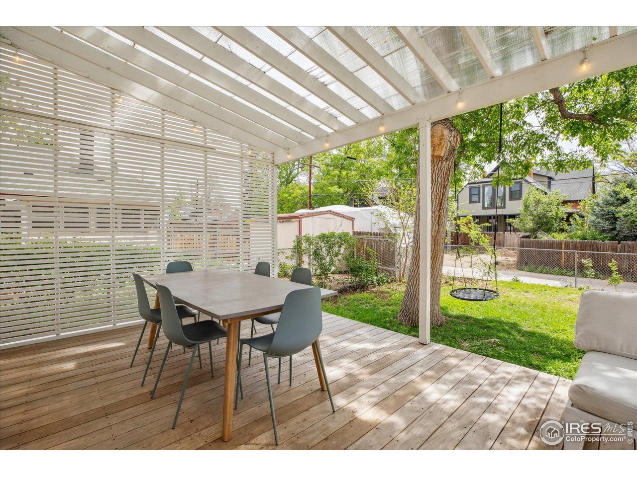2844 Quitman Street Denver, CO 80212 - Photo 34 of 41 a view of a patio with a table chairs and a backyard