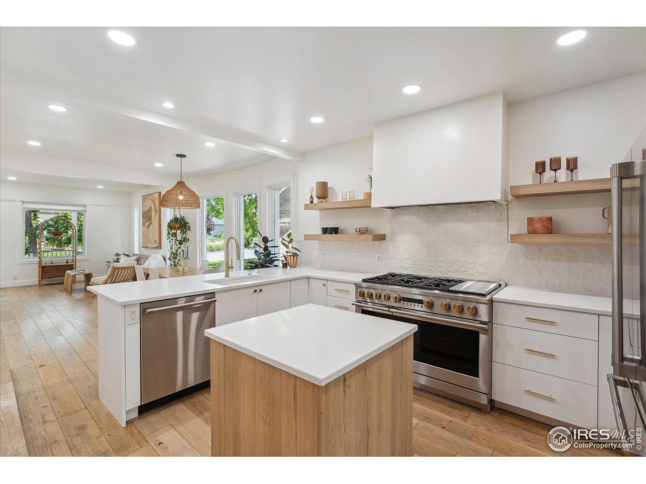 2844 Quitman Street Denver, CO 80212 - Photo 4 of 41 a kitchen with a stove a sink and a refrigerator