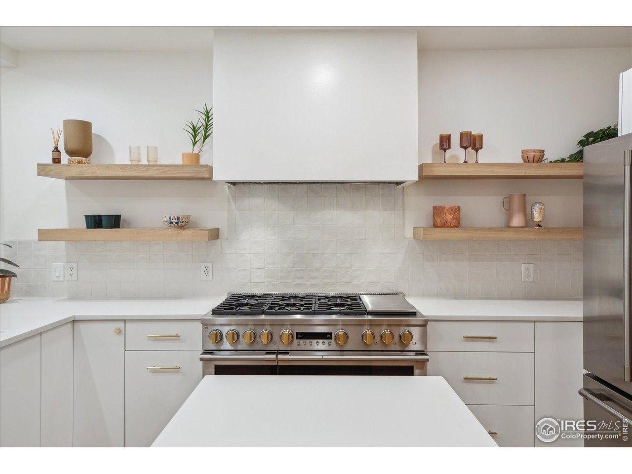 2844 Quitman Street Denver, CO 80212 - Photo 5 of 41 a kitchen with a stove and cabinets