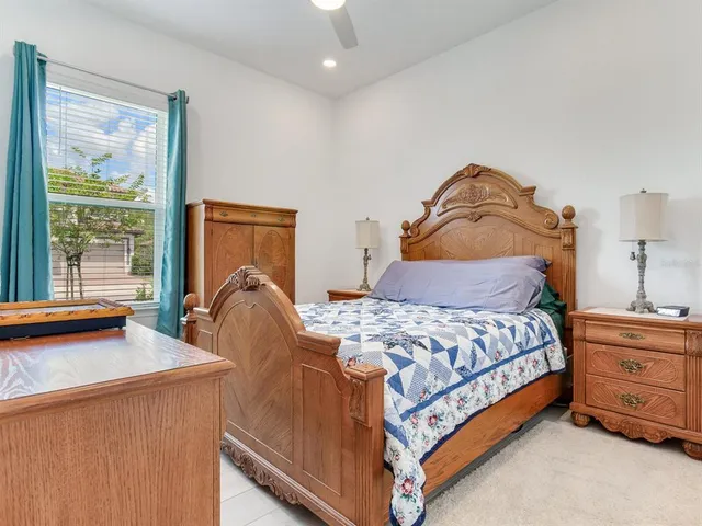 a bedroom with a bed and couch