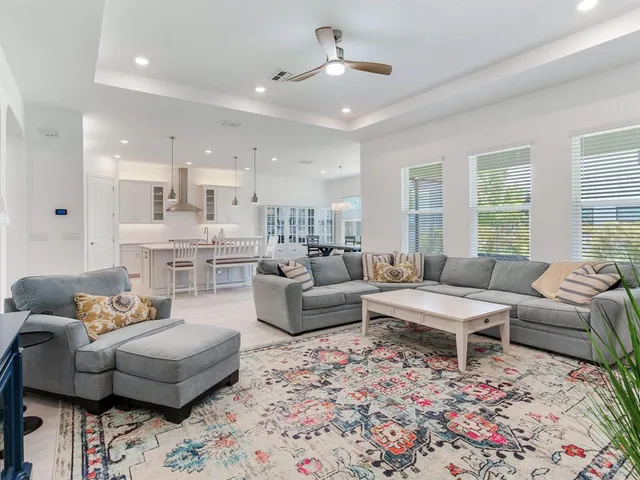 a kitchen with stainless steel appliances kitchen island a refrigerator and a stove top oven