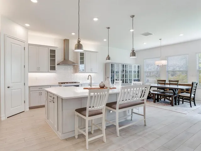 a spacious bedroom with a bed and a couch