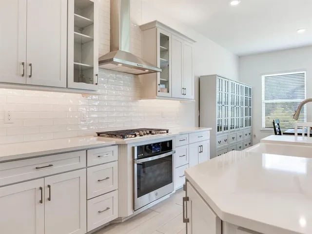 a backyard of a house with lots of green space and fountain