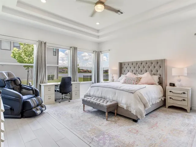 a view of a house with backyard porch and sitting area