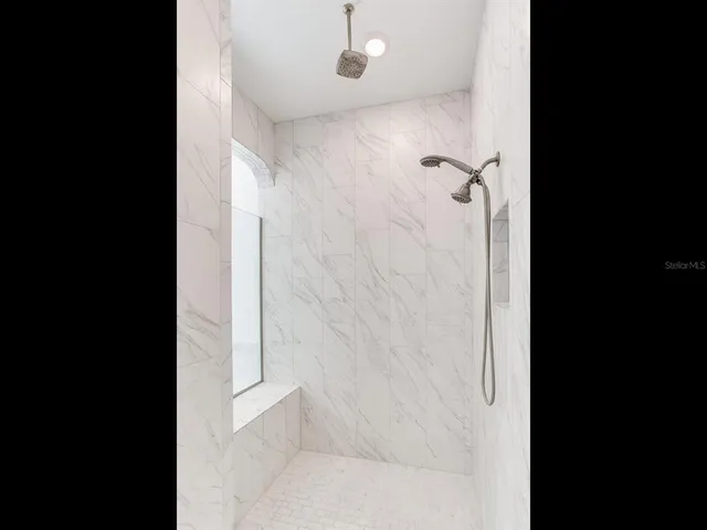 a view of a street with a yard and a fountain