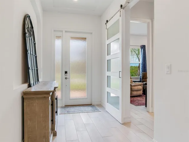 a bathroom with a double vanity sink toilet mirror and shower