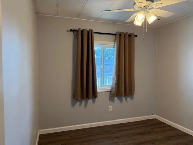 a view of balcony with wooden floor