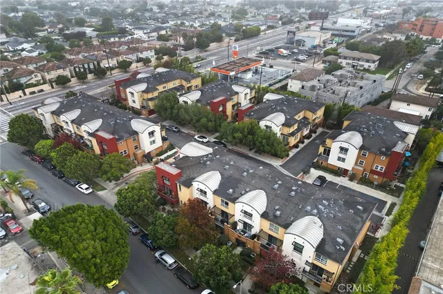 an aerial view of residential houses with outdoor space