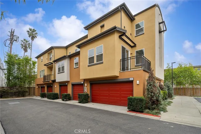 a view of a house with a yard and plants