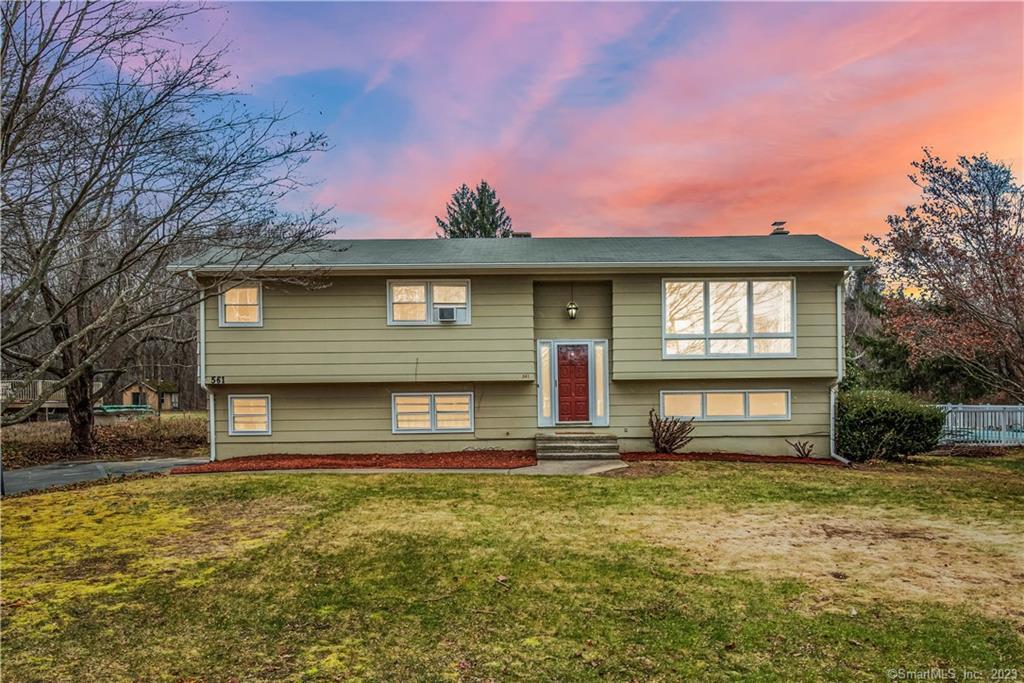 561 Spindle Hill Road Wolcott, CT 06716 - Photo 1 of 1 a front view of a house with a yard