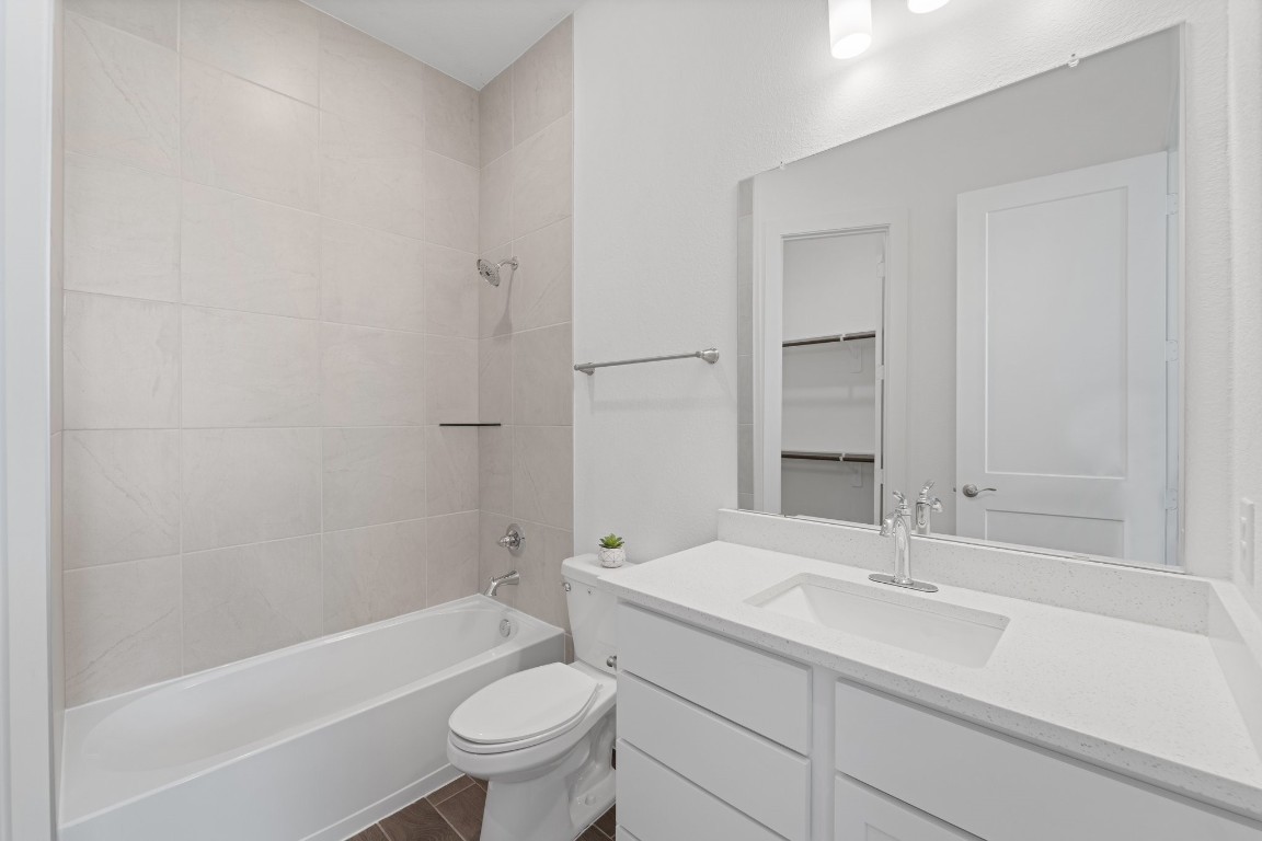 310 Blue River Trail Rosenberg, TX 77471 - Photo 11 of 47 a bathroom with a sink toilet and shower