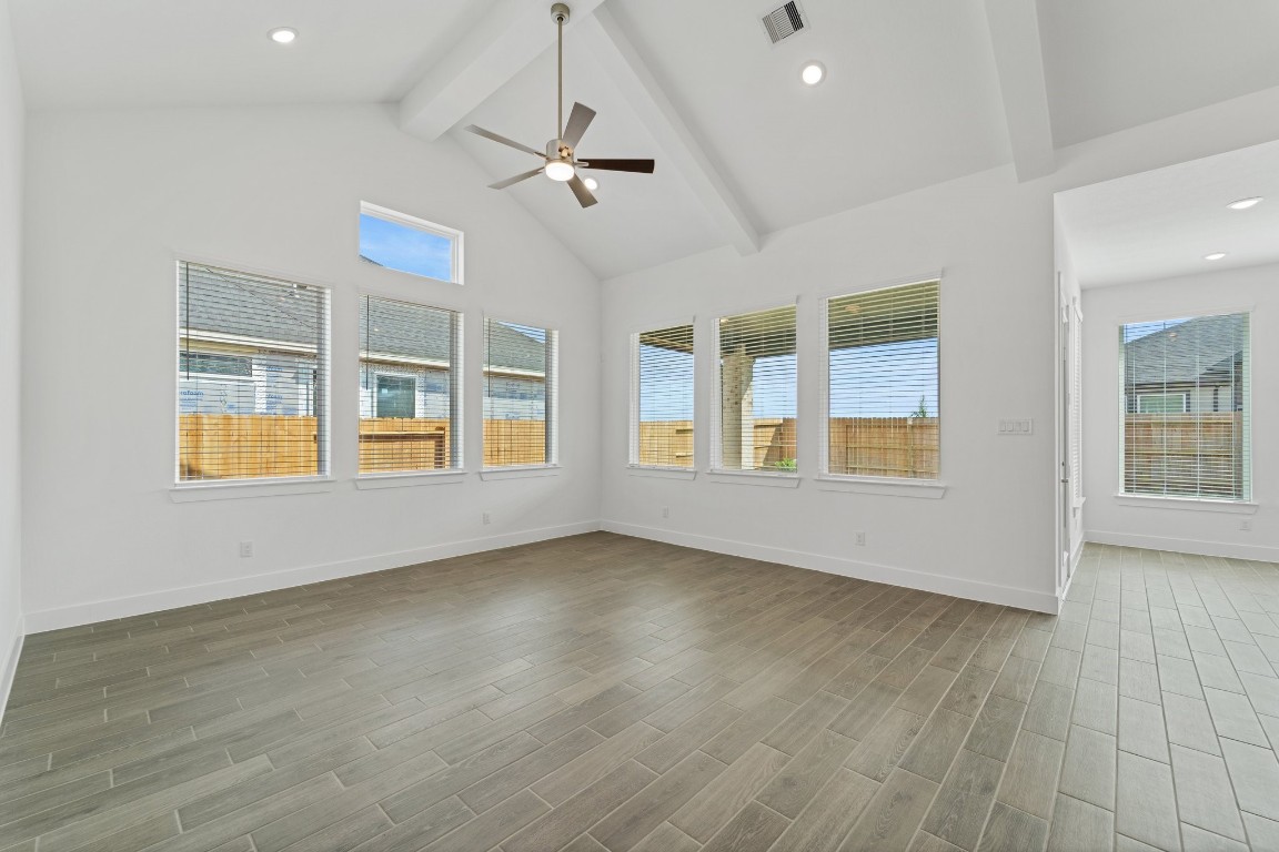 310 Blue River Trail Rosenberg, TX 77471 - Photo 14 of 47 a view of an empty room with a window and wooden floor